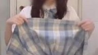 Slutty young girl in a JK uniform masturbates to climax in her dorm room