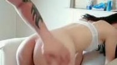 Girl in stockings, heels, and a tight skirt gets wild with a tattooed guy, giving head and taking a huge cock. He's pulling her from under the bed.